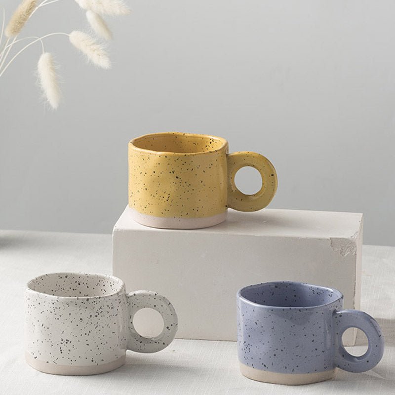 Solar Radiance Yellow ceramic coffee mug on a modern minimalist workspace desk as organic office decor.